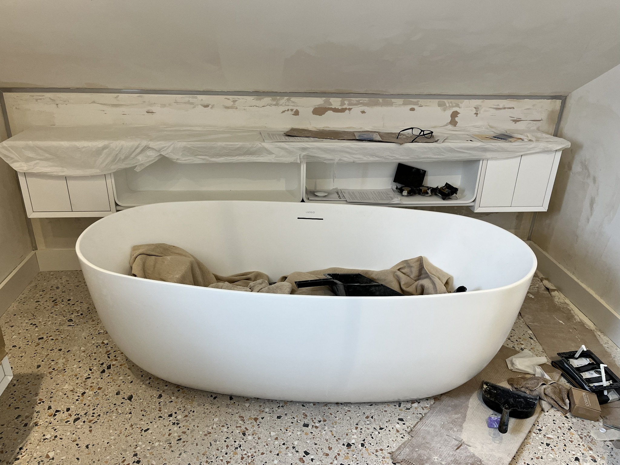 Lusso freestanding bath during installation